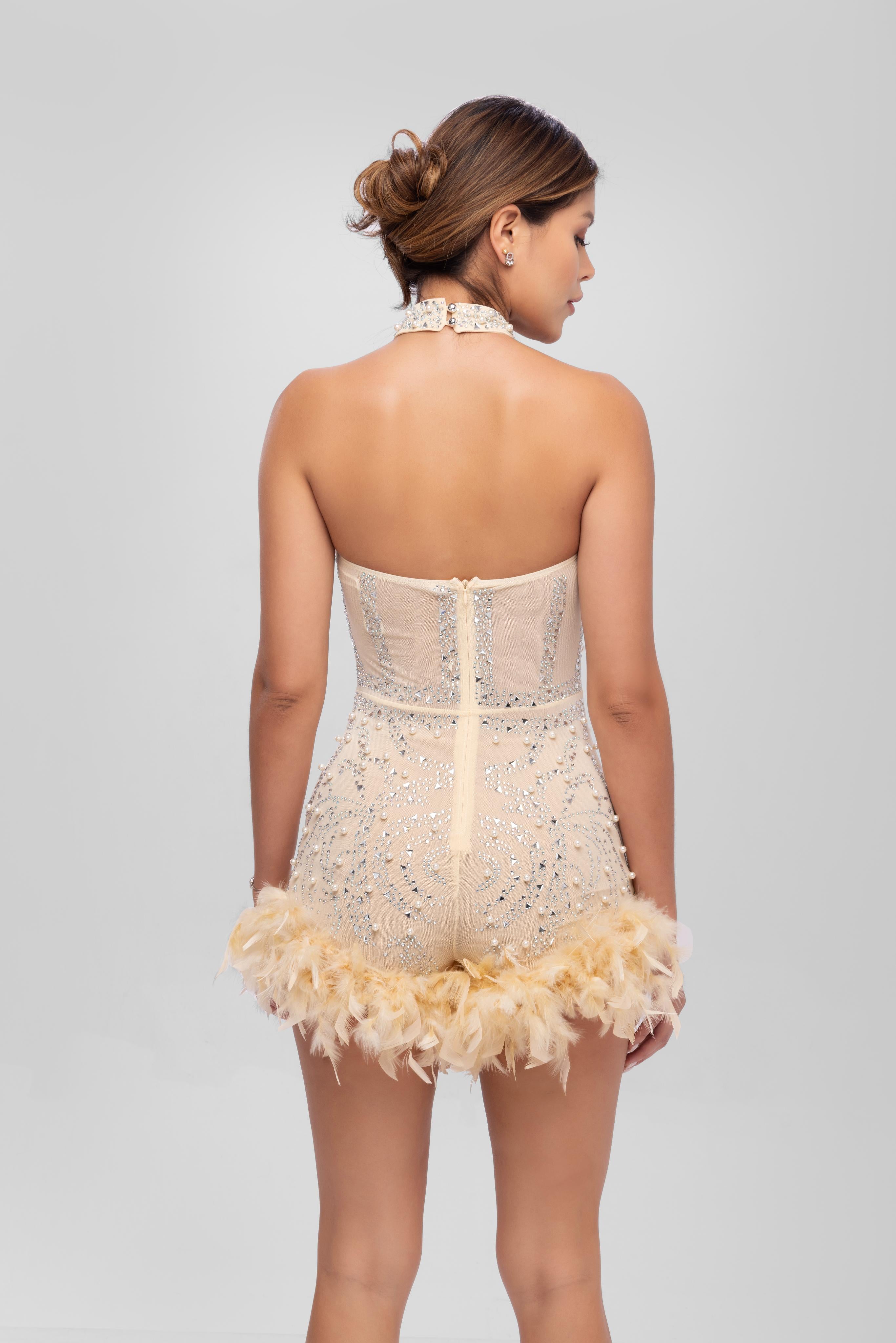 Embellished romper with feather Beige